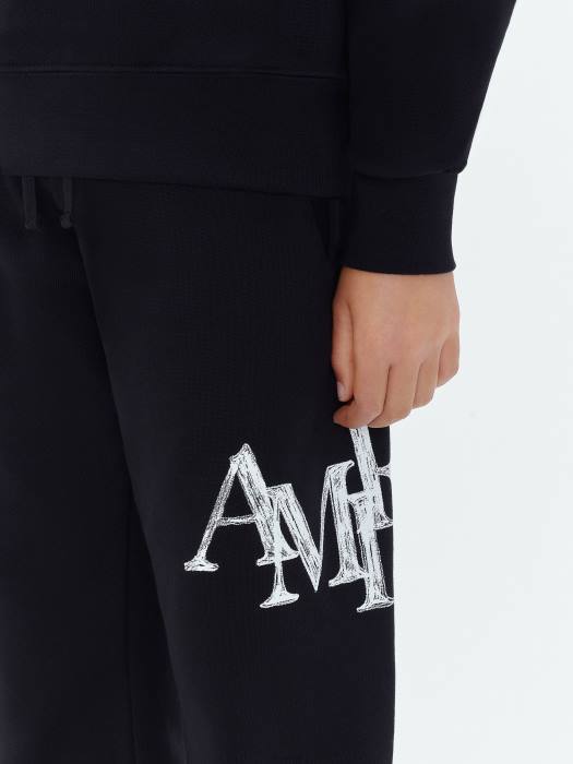 AMIRI barn svart merke staggered scribble joggebukse NFBX361